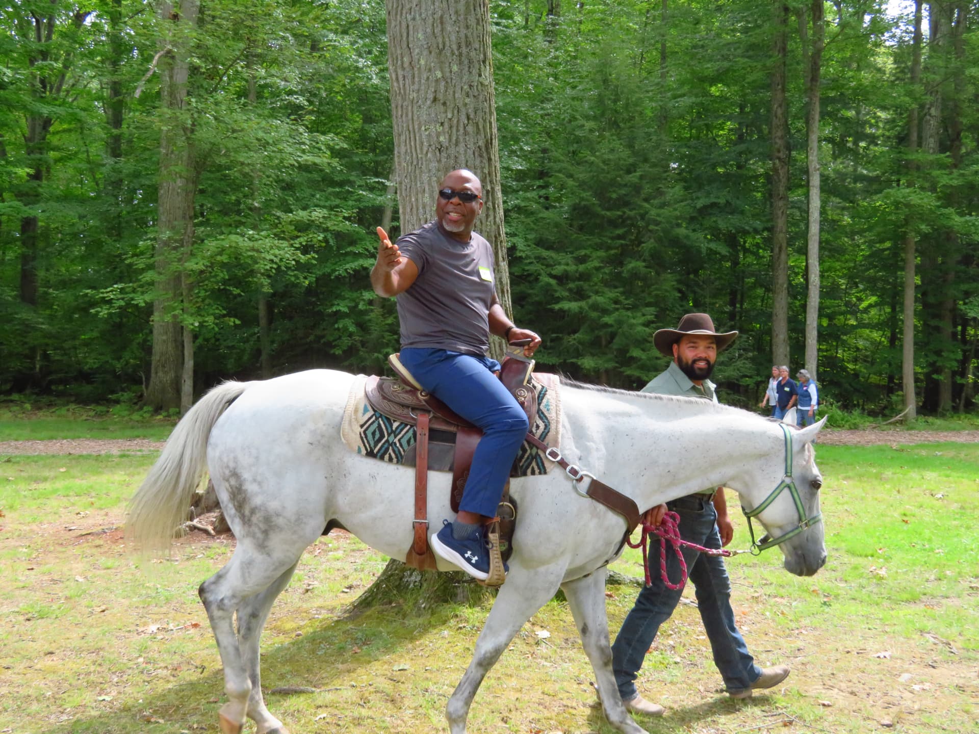 Pastor Theo smiling during his horseback ride at the picnic