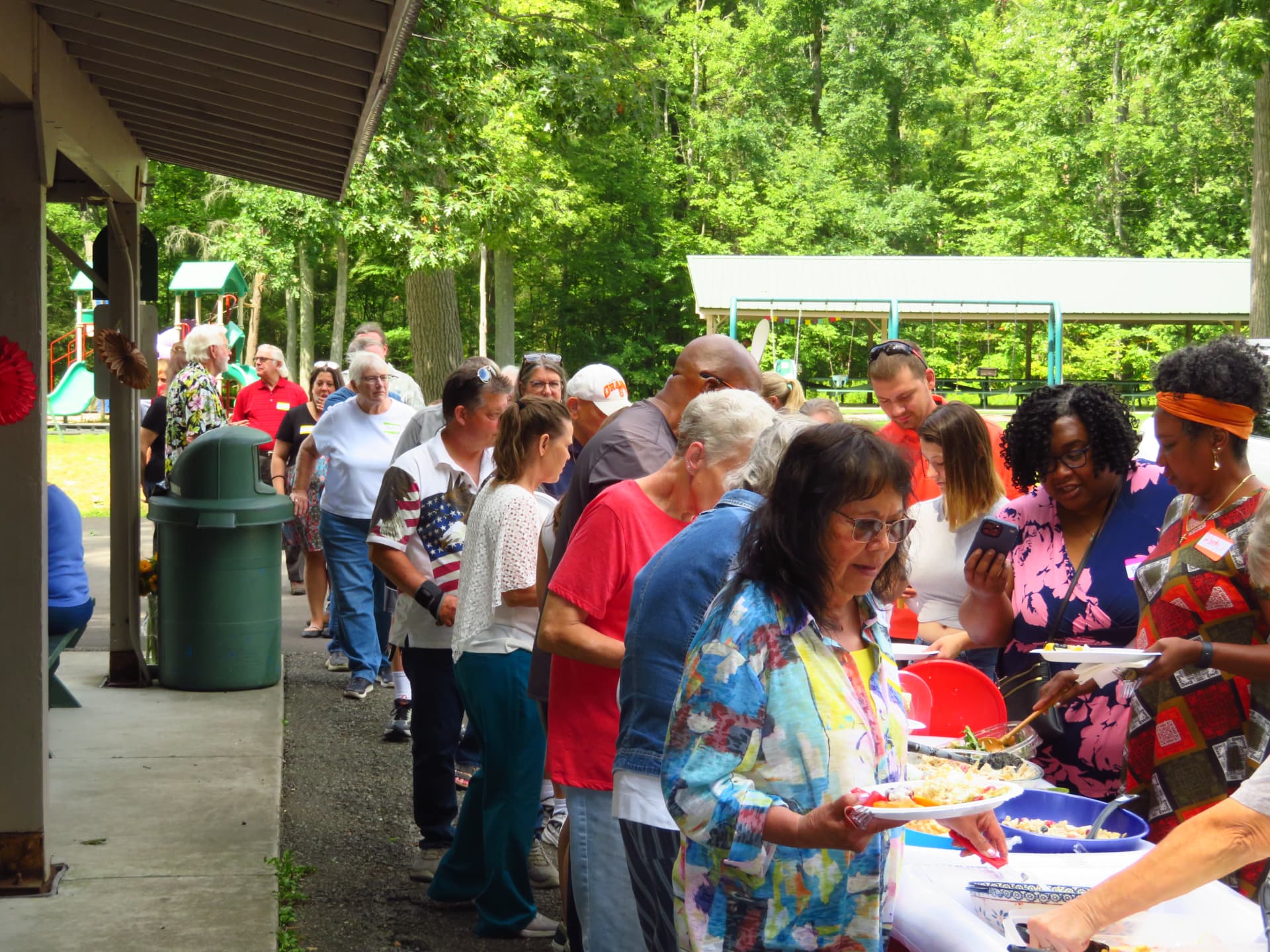 A long line of members serving themselves along the buffet tables